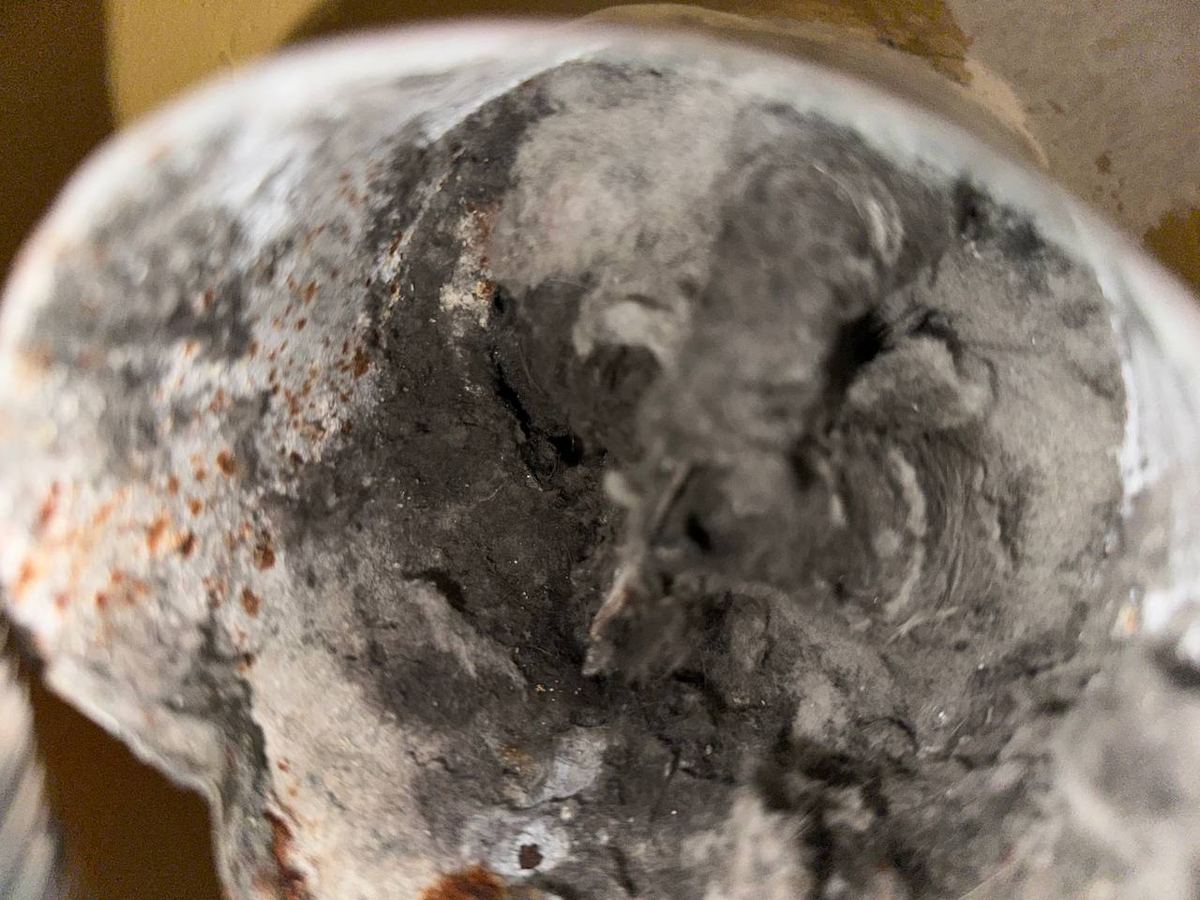 Dirty air duct before cleaning — Apex Air Services Massachusetts